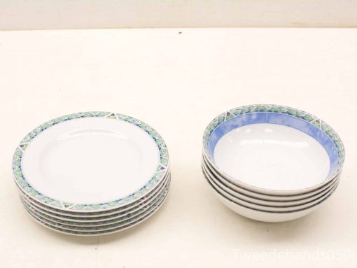 Elegant vintage dinnerware set with decorative plates and bowls for stylish dining experiences.