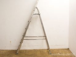 Durable used aluminum A-frame ladder for home projects and maintenance tasks.