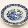 Beautiful blue and white porcelain plate featuring intricate floral and bird designs.