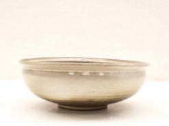 Elegant ceramic bowl with a handmade design, perfect for serving or as a decorative accent.