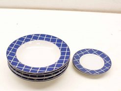 Elegant ceramic plates with modern blue geometric patterns for versatile dining experiences.