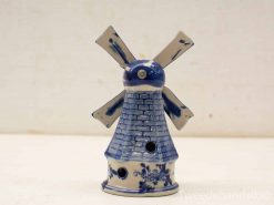 Charming blue-and-white ceramic windmill decoration, inspired by traditional Delftware style.