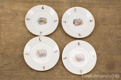 Elegant decorative plates with whimsical scenes and intricate illustrations for unique table settings.