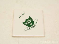 Ceramic tile commemorating 85 years of Nij. Groeningen with a green NVH emblem.