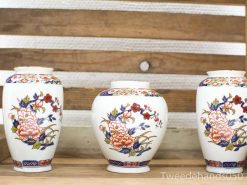 Elegant vintage vases with floral patterns, adding charm to any decor or art collection.