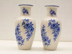 Elegant decorative vases with blue floral patterns, perfect for enhancing any interior space.