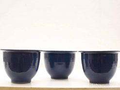 Deep blue ceramic bowls, elegant vintage set for serving and decoration, timeless home accent.