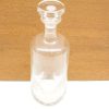 Elegant glass decanter for serving spirits or as a stylish decorative piece.