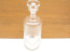 Elegant glass decanter for serving spirits or as a stylish decorative piece.