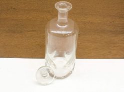 Elegant glass carafe with lid, perfect for vintage decor and stylish kitchen use.