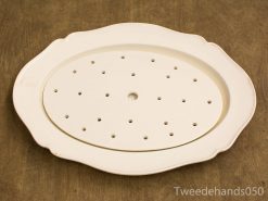 Elegant vintage oval ceramic serving platter with scalloped edges and functional drainage holes.