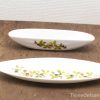 Elegant porcelain serving dishes with botanical designs, perfect for appetizers and salads.