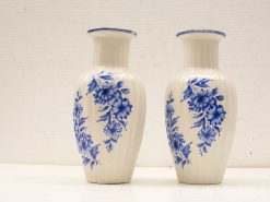 Elegant blue and white porcelain vases with intricate floral designs, perfect for any decor.