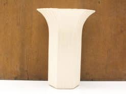 Elegant vintage vase with scalloped edge and vertical grooves, perfect for any decor style.