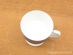 Elegant white cup with earthy band, perfect for stylish, everyday drinking experiences.