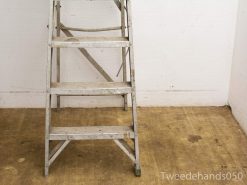 Durable aluminum step ladder with marks, ideal for indoor and outdoor tasks.