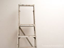 Vintage metal ladder with patina, ideal for home improvement and stylish projects.