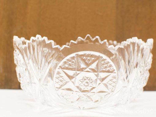 Elegant crystal bowl with geometric patterns, perfect for serving or as a decorative centerpiece.