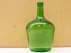 Vintage green glass bottle with distinctive bulbous shape, perfect for wine or oil storage.