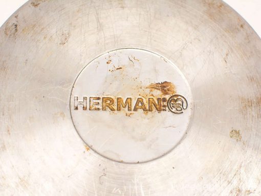 Vintage Herman cooking pan with charming patina and history of culinary adventures.