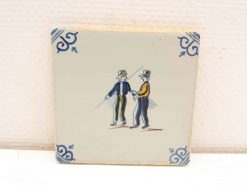 Vintage tile featuring two figures in conversation, vibrant colors and elegant patterns enhance decor.