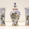 Elegant vintage ceramic vase set with intricate hand-painted rural scenes, perfect for home decor.