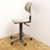 Stylish gray office chair with ergonomic design and adjustable height for comfort and mobility.