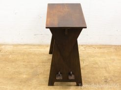 Elegant minimalist wooden table with unique triangular base, perfect for modern interiors.