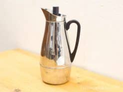 Sleek chrome vacuum coffee pot with ergonomic handle, modern design for stylish kitchens.