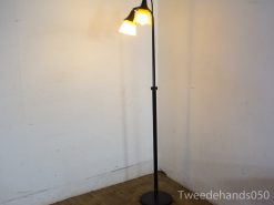 Sleek modern floor lamp with amber and white glass shades for stylish ambient lighting.