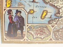 Historical map of the Zuiderzee and Friesland showcasing traditional attire and cultural heritage.