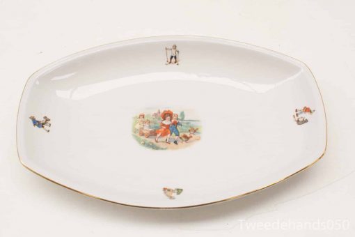 Vintage porcelain dish featuring playful children and animals, elegantly designed for decor or dining.