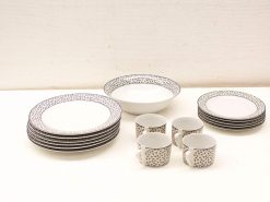 Elegant porcelain tableware set with floral design, perfect for stylish dining occasions.