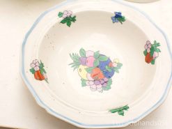 Elegant vintage porcelain bowl with vibrant floral and fruit motifs, perfect for your table setting.