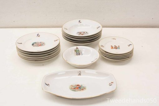 Elegant porcelain dinnerware set with historical motifs for special occasions and decorative display.