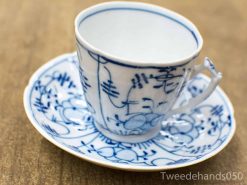 Elegant blue and white porcelain tea cup and saucer set for refined afternoon tea.