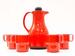 Red ceramic coffee pot set with four matching mugs, perfect for stylish coffee moments.