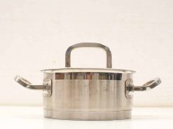 Sleek stainless steel cooking pot with lid and cool handles for safe, versatile use.