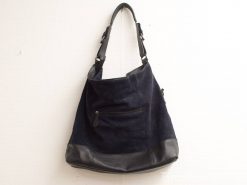 Chic navy suede shoulder bag with leather base, stylish and functional for any occasion.