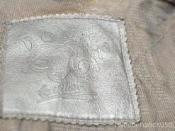 Stylish embossed leather patch adds elegance to mens fashion with artisanal flair.