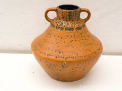 Elegant terracotta pot with geometric patterns, perfect for decoration or practical use.