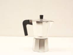 Classic aluminum moka pot for coffee lovers, featuring iconic octagonal design and shiny finish.