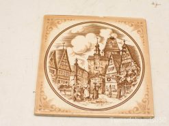 Charming vintage village scene plate featuring half-timbered houses and a picturesque clock tower.