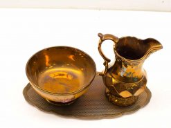 Elegant vintage gold pitcher, bowl, and tray set for timeless decor and refined table settings.