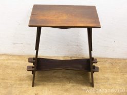 Stylish vintage wooden side table with elegant X-shaped support and rich dark finish.