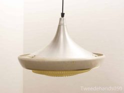 Sleek metallic pendant light with vintage charm, ribbed design for ambient illumination.