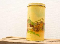 Vintage tin container featuring a nostalgic horse-drawn carriage in a charming countryside scene.