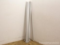 Stylish white poles for home or office: versatile and minimalist storage solutions.