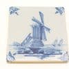 Vintage blue windmill tile featuring serene nature and sailing boats in a picturesque landscape.