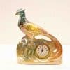 Elegant ceramic pheasant clock with iridescent colors, perfect for decorative home styling.